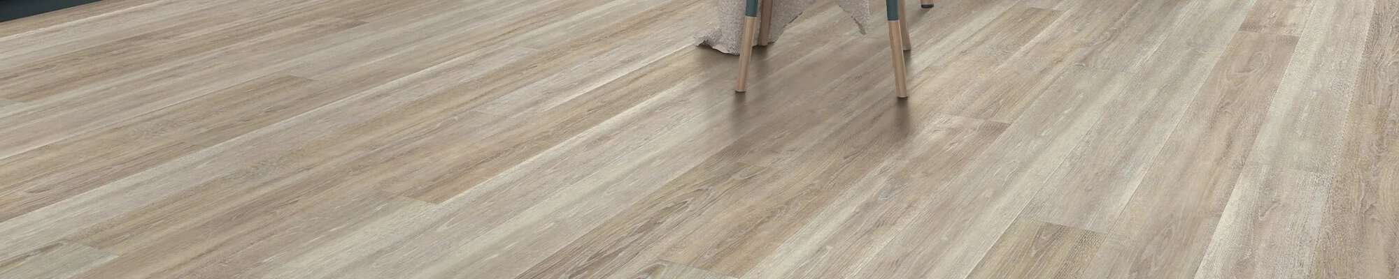 Woman choosing new flooring in the store